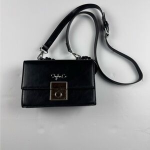 Stylish Black Crossbody single flap purse in the color black